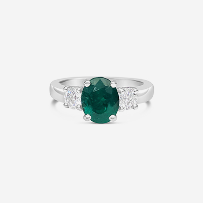 Platinum emerald and diamond engagement ring