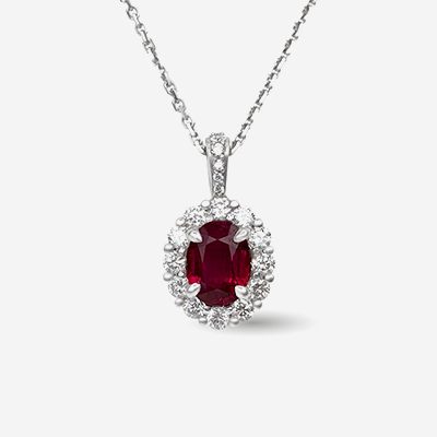 14kt oval ruby and diamond halo pendant
