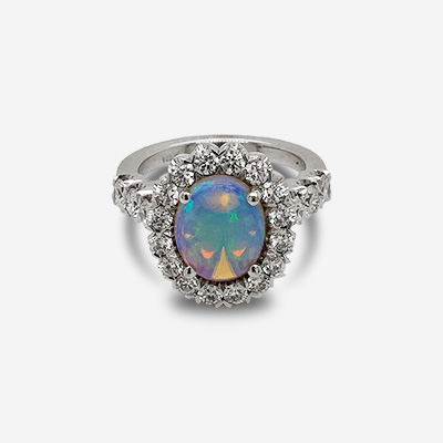 Platinum Oval Opal and Diamond Halo Ring