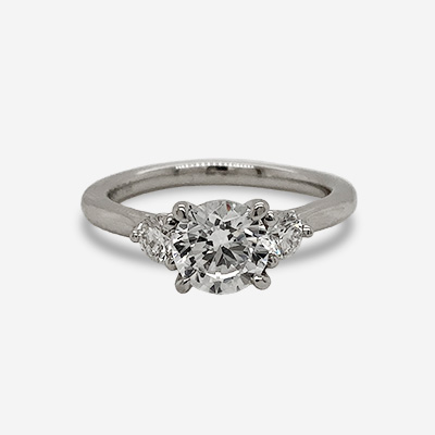 Platinum Three Stone Round Diamond and CZ Ring