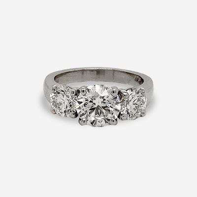 Platinum Round Center Diamond Three Stone Ring