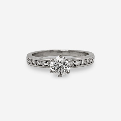 Platinum Tiffany Round Center Diamond Channel Ring