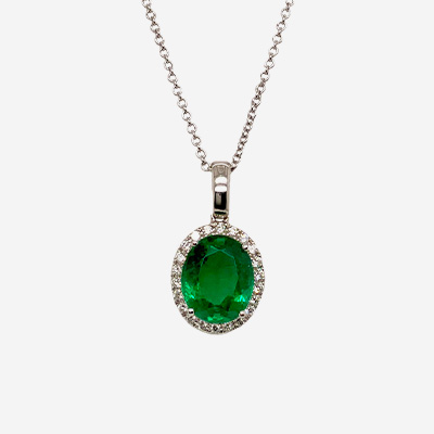 18KT White Gold Oval Emerald and Diamond Halo Pendant