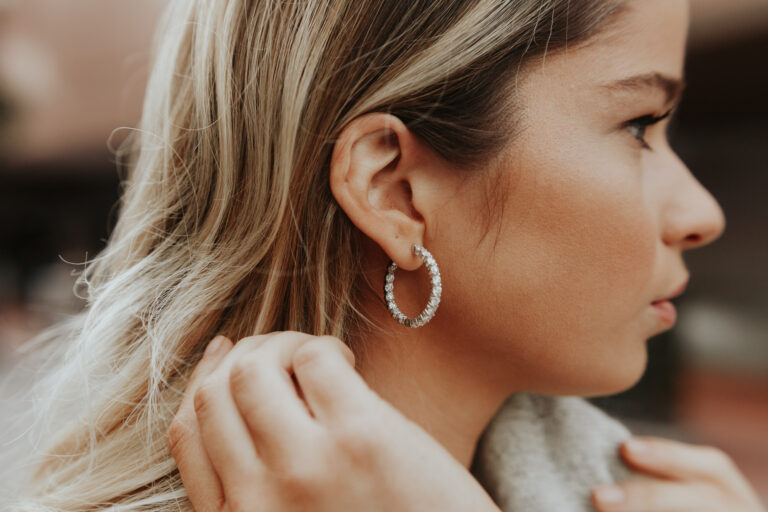 Woman wearing gold hoop earrings