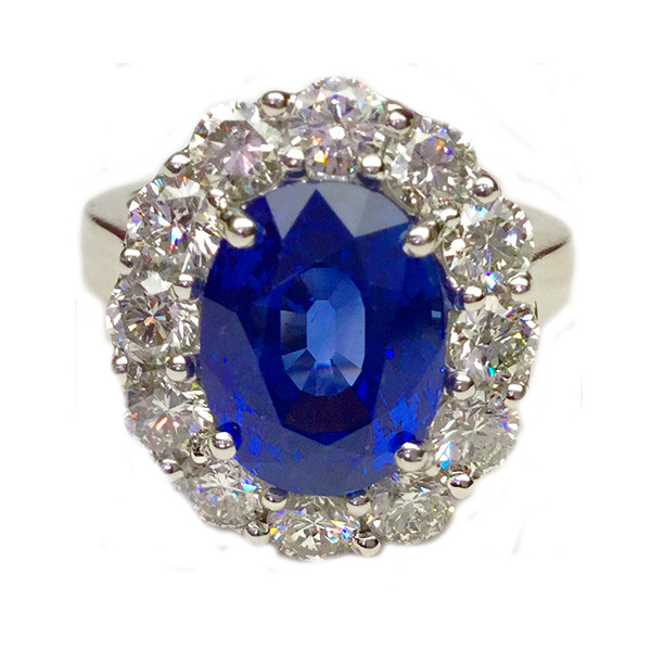 E.B. Horn Platinum Oval Sapphire And Diamond Halo Ring